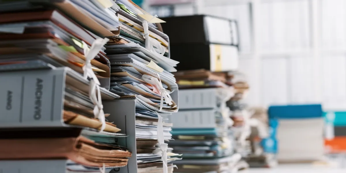 Stacks of paperwork and files in the office